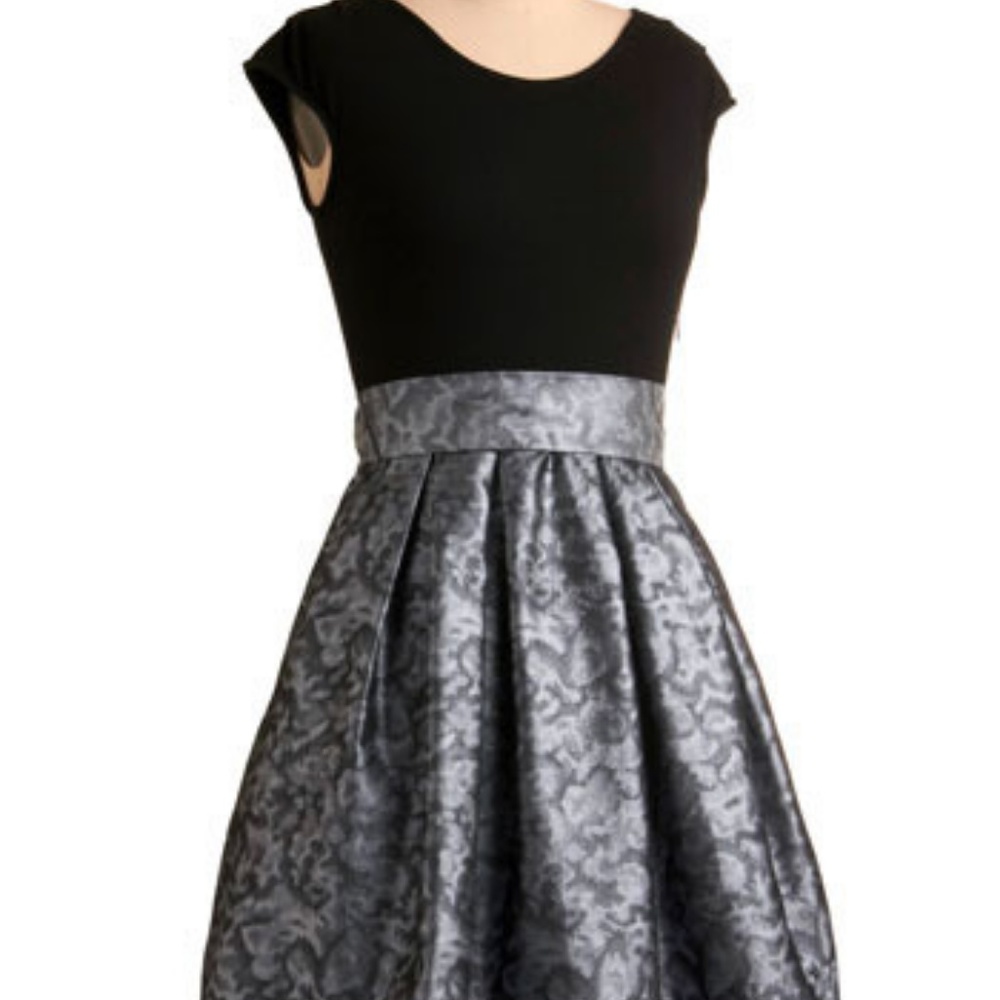 Black top cocktail dress with shimmer skirt bottom